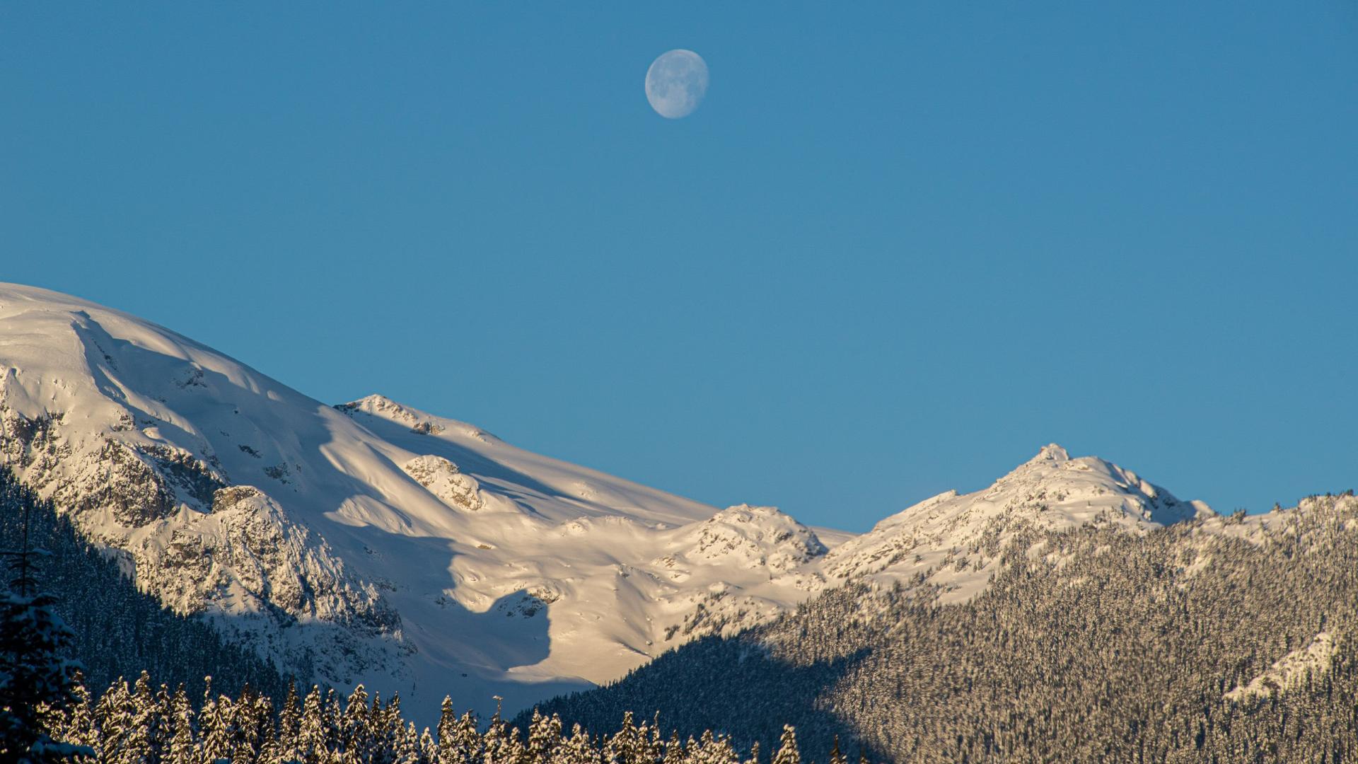 Area B - winter alpine with snow and moon in a blue sky